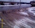 Этот участок дороги отремонтирован за счет жителей, городская техника здесь только снег чистит.