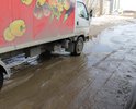 Ямы и неровности на дороге по ул. Меньшикова в районе дома №18