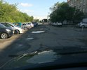 Убитая дорога, подъезд к ИФНС Кировского района. Сотни жителей ежедневно приезжают, а тут яма на яме