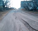 Разбитая дорога по ул. Петра Ильичева, от первого поворота налево и до домов 35 и 24А. Дорогу вымывает после каждого циклона. Ямы, выбоины становятся все глубже. После сильных дождей, песок, гравий с дороги вымывается на проезжую часть.