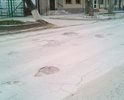 По переулку Красному между улицами Александровская и Октябрьская многочисленные ямы и повреждения дорожного полотна по всей ширине проезжей части.