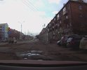 Разбитый дублирующий проезд вдоль ул.Мичурина
