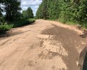 Разбитая грунтовая дорога, местами отрезки с разбитым асфальтом на отрезке дороги 49Н-0538 от Перерва до Полново