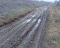 Добрый день! Обращаемся к Вам по поводу отсутствия дороги на наших улицах. Дело в том, что на них абсолютно отсутствует какое либо дорожное покрытие. В результате, все жители наших улиц: Черниговская и 1-го Мая, пгт. Приморский, г. Феодосия, в осенний, зимний и весенний период (дождей и холодов) просто утопают в грязи. На наших улицах проживают старики, которые ежедневно преодолевают до 2 километров туда и обратно к ближайшему магазину, дети, которым не то что негде играть, порой за пределы дворов выйти не возможно. А ведь им каждое утро еще и в школу нужно ходить. Представьте в каком виде ребенок приходит в школу? Данная ситуация еще усугубляется тем, что начиная от дома 24 по улице Черниговская и до пересечения с улицей 1-го Мая, примерно 300 метров, на улице полностью отсутствует освещение. По вечерам в кромешной тьме, мы возвращаемся с работы по колено в грязи. В бесчисленных ямах и колдобинах владельцы автомобилей разбивают подвеску на своих авто, ремонт которых стоит нам не малых денег. Мы регулярно своими силами подсыпаем на дорогу щебень, но он бесследно утопает в грязи. В добавок ко всему, по улицам: Черниговской и 1-го Мая, периодически ездит тяжелая техника: самосвалы, трактора, а порой фуры и автобусы. После них проехать и летом становится невозможно. Люди вынуждены ходить по остаткам насыпи от железной дороги, но из-за отсутствия освещения и обилия глубоких ям мы рискуем переломать ноги. Летом насыпь обрастает травой с острыми колючками и шипами и ее никто не убирает.
В связи с выше изложенным просим Вас помочь нам достучаться до властей города, чтобы они приняли меры для приведения наших улиц в надлежащее состояние. В настоящий момент мы собираем подписи жителей наших улиц для обращения к Главе МКУ «Приморская поселковая администрация 
Администрации города Феодосии Республики Крым» Шевченко И.А.