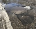 Главная объездная улица района. Ежедневный трафик состоящий из автобусов, маршрутных такси, самосвалов и других транспортных средств в купе с нашими морозам разбили, вдавили в землю асфальт по улице Кольцевой. Ремонта дорога не видела 7 лет. Несколько лет назад самые страшные дыры в асфальте пытались заделать "заплатками", но на дороге остался только щебень этих заплаток.