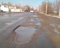 Ул.Кооперативная является частью маршрута на грузовой морской порт г.Азова, а также используется местными жителями для ежедневных передвижений, выезда из города в областной центр и населенные пункты района. Последние годы на улице проводится не своевременный точечный ямочный ремонт, которого в виду износа дороги и увеличения грузооборота морского порта явно не достаточно. Точечного ремонта хватает на 10-30 дней, после картина с ямами, выбоинами, колеёй не то чтоб обновляется, а только расширяет свои границы. На расположенных на улице нерегулируемых железнодорожных переездах более 50% времени в году наблюдаются ямы, выбоины, проломы, которые представлены на фото.