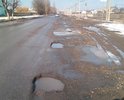 Ул.Кооперативная является частью маршрута на грузовой морской порт г.Азова, а также используется местными жителями для ежедневных передвижений, выезда из города в областной центр и населенные пункты района. Последние годы на улице проводится не своевременный точечный ямочный ремонт, которого в виду износа дороги и увеличения грузооборота морского порта явно не достаточно. Точечного ремонта хватает на 10-30 дней, после картина с ямами, выбоинами, колеёй не то чтоб обновляется, а только расширяет свои границы. На расположенных на улице нерегулируемых железнодорожных переездах более 50% времени в году наблюдаются ямы, выбоины, проломы, которые представлены на фото.