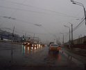 огромные ямы, скрытые постоянными лужами из-за просадки асфальта на перекрестке ул. 50 лет Октября - пр-кт Дружбы при движении от ул. Запольная в направлении ул. Планерная