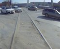 Провал асфальта на пересечении железнодорожных путей улицы Вятская рядом с АЗС Ростнефть