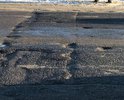Разбито дорожное полотно, ямы превышают нормативно допустимые размеры - создают реальную опасность для безопасности дорожного движения.