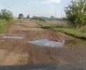 Данный участок дороги разбит полностью. По данной дороге невозможно ездить. Администрация района бездействует. По данному участку дороги возят учеников, школьный автобус совершает 5 рейсов в день.
