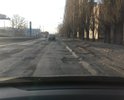 Полностью разбито дорожное полотно на всей улице, огромные ямы,  не соответствующие ГОСТ.
