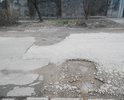 Яме уже скоро год!глубина ямы от 15см до 23см. Приходится выезжать на встречку чтоб проехать между ямами,очень опасно т.к. за углом поворот!