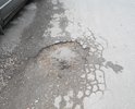 Яме уже скоро год!глубина ямы от 15см до 23см. Приходится выезжать на встречку чтоб проехать между ямами,очень опасно т.к. за углом поворот!