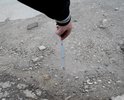 Яме уже скоро год!глубина ямы от 15см до 23см. Приходится выезжать на встречку чтоб проехать между ямами,очень опасно т.к. за углом поворот!