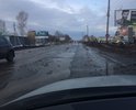 Одна из самых больших улиц города, постоянно в воде и ямах, скрывающих половину колеса легкового автомобиля.