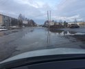 Одна из самых больших улиц города, постоянно в воде и ямах, скрывающих половину колеса легкового автомобиля.