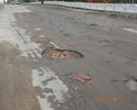 Центральная улица города.  Состояние дорожного полотна видно на фотографиях. Движение по этому участку с разрешенной скоростью 60 км/ч, не исключает возможность не справиться с управлением, либо причинить вред т/с, а именно "убить" элементы подвески, погнуть диски, лопнуть шины и др. Ямочный ремонт является неэффективным средством решения данной проблемы, так как его результат заметен лишь некоторое время.