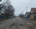 Центральная улица города.По ней осуществляется въезд/выезд в/из город(а). Состояние дорожного полотна видно на фотографиях. Движение по этому участку с разрешенной скоростью 60 км/ч, не исключает возможность не справиться с управлением, либо причинить вред т/с, а именно "убить" элементы подвески, погнуть диски, лопнуть шины и др.
