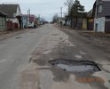 Центральная улица города.По ней осуществляется въезд/выезд в/из город(а). Состояние дорожного полотна видно на фотографиях. Движение по этому участку с разрешенной скоростью 60 км/ч, не исключает возможность не справиться с управлением, либо причинить вред т/с, а именно "убить" элементы подвески, погнуть диски, лопнуть шины и др.