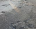 Вся ул.Мальцева в глубоких и широких ямах в остатках асфальта. Отвратительное состояние.