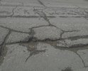 Состояние дороги просто ужасное. Ездить невозможно. Автомобилисты ездят по обочине, а правила дорожного движения это запрещают. А как еще ездить? Камазисты со своими колесами всю дорогу разбомбили. В прошлом году отремонтировали участок в метров 200-300 и на этом все. Можно подумать большое дело сделали. А эти 200-300 метров погоды не сделали. С каждым годом состояние дороги просто ухудшается. Можно сказать, что ее совсем нет. И эта вся дорога такая, как на фото. Отремонтируйте пожалуйста, ездить ведь невозможно.