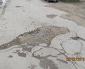 Проблема в отсутствие дорожного покрытия для нормального существования взрослых и детей. Остатки асфальта разрушает частная фирма двигаясь по улице 20 тонными автомобилями, а городским властям нет время на нас.