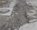 Проблема в отсутствие дорожного покрытия для нормального существования взрослых и детей. Остатки асфальта разрушает частная фирма двигаясь по улице 20 тонными автомобилями, а городским властям нет время на нас.