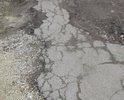 Проблема в отсутствие дорожного покрытия для нормального существования взрослых и детей. Остатки асфальта разрушает частная фирма двигаясь по улице 20 тонными автомобилями, а городским властям нет время на нас.