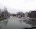 По этой городской улице города Шарья легковой автомобиль может передвигаться только на первой скорости. Ехать быстрее опасно, из-за вероятности напороться на  арматуру старой бетонки или получить "подарок" от лежащего в луже постороннего предмета.