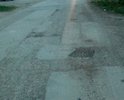 Здравствуйте! Дорога по ул. Украинская при въезде с ул. Мира и до трамвайной линии имеет дефекты дорожного покрытия, в виде ям (глубиной более 15 см.)