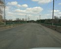 Мост в г.Жирновск через реку Медведица ремонтируется каждый год и каждый год этот ремонт приходит в негодность. В этом году его уже латали, но эффекта ноль. Дорога опять разбита. А съезды с моста это прям трамплины какие-то. Даже на скорости 50 км/ч. при въезде на мост складывается ощущение, что что сейчас взлетишь. Перепад полотна очень сильный. И чтобы ехать более менее плавно, приходиться ехать как "черепаха" 25 - 30 км/ч.