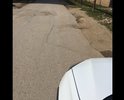 Неровная дорога, отсутствуют тротуары , разметка, торчащие и открытые люки