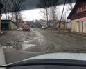 Когда-то здесь был хороший асфальт и тротуары, сейчас все пришло в негодность. Вода течет по проезжей части.
