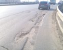 На повороте с ул. Пушкина на пр. Комсомольский разрушение асфальтового покрытия.