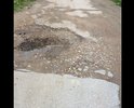 Разбитая дорога, без тротуаров , ямы