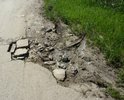 Асфальтированная часть дороги около школы №19. Ужасное состояние, представляет большую угрозу школьникам и родителям объезжающими ямы автомобилями. Не считая этого участка, дорога на улице Чкалова не существует, только направление.