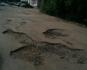 Разбита дорога на бульваре Энтузиастов дом 1ж корп.1 около РОСРЕЕСТРА