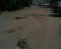 Разбита дорога на бульваре Энтузиастов дом 1ж корп.1 около РОСРЕЕСТРА