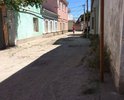 Дорожное покрытие улицы полностью отсутствует, дорога разбита, из-за ям и бугров невозможно не только проехать, но и пройти, хотя движение в этом районе достаточно интенсивное.