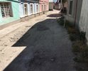 Дорожное покрытие улицы полностью отсутствует, дорога разбита, из-за ям и бугров невозможно не только проехать, но и пройти, хотя движение в этом районе достаточно интенсивное.