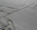 От пересечения улиц Портовая - Дзержинского и вниз по ул Дзержинского до пересечения К. Маркса дорожное полотно имеет разного типа дефекты. Выборочный ремонт.
