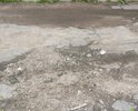 Разбита дорога на съезде с ул. Большая Прорубная к гаражам напротив дома 16 на ул. Сухова