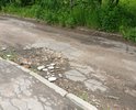 Разбита дорога на съезде с ул. Большая Прорубная к гаражам напротив дома 16 на ул. Сухова