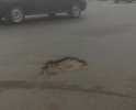 Яма между Богом и Властью. От церкви и от Администрации гороао до этой ямы несколько метров, центр города, движение оживленное, и она очень мешает!