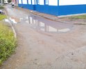 Во дворе между домом №21 ул.Ленина и домом №1 ул.Зарипова. Повсюду ямы, размытый асфальт, грязь, огромные лужи. Невозможно выходить с детьми, катить детскую коляску.