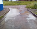 Во дворе между домом №21 ул.Ленина и домом №1 ул.Зарипова. Повсюду ямы, размытый асфальт, грязь, огромные лужи. Невозможно выходить с детьми, катить детскую коляску.