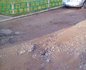 Во дворе между домом №21 ул.Ленина и домом №1 ул.Зарипова. Повсюду ямы, размытый асфальт, грязь, огромные лужи. Невозможно выходить с детьми, катить детскую коляску.
