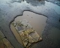 ремонт проводили на данном участке в прошлом году, нормальная дорога была ровно 2 месяца. глубина максимальная 10 см , средняя 6-7 см. 
постоянная огромная лужа . очередь утром для перехода до 30 человек. жильцы ведут детей в детские сады и школы. выбоины в месте перехода .