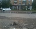 Неудовлетворительное состояние дорожного покрытия дороги на перекрестке улиц Тельмана и Щетинкина.